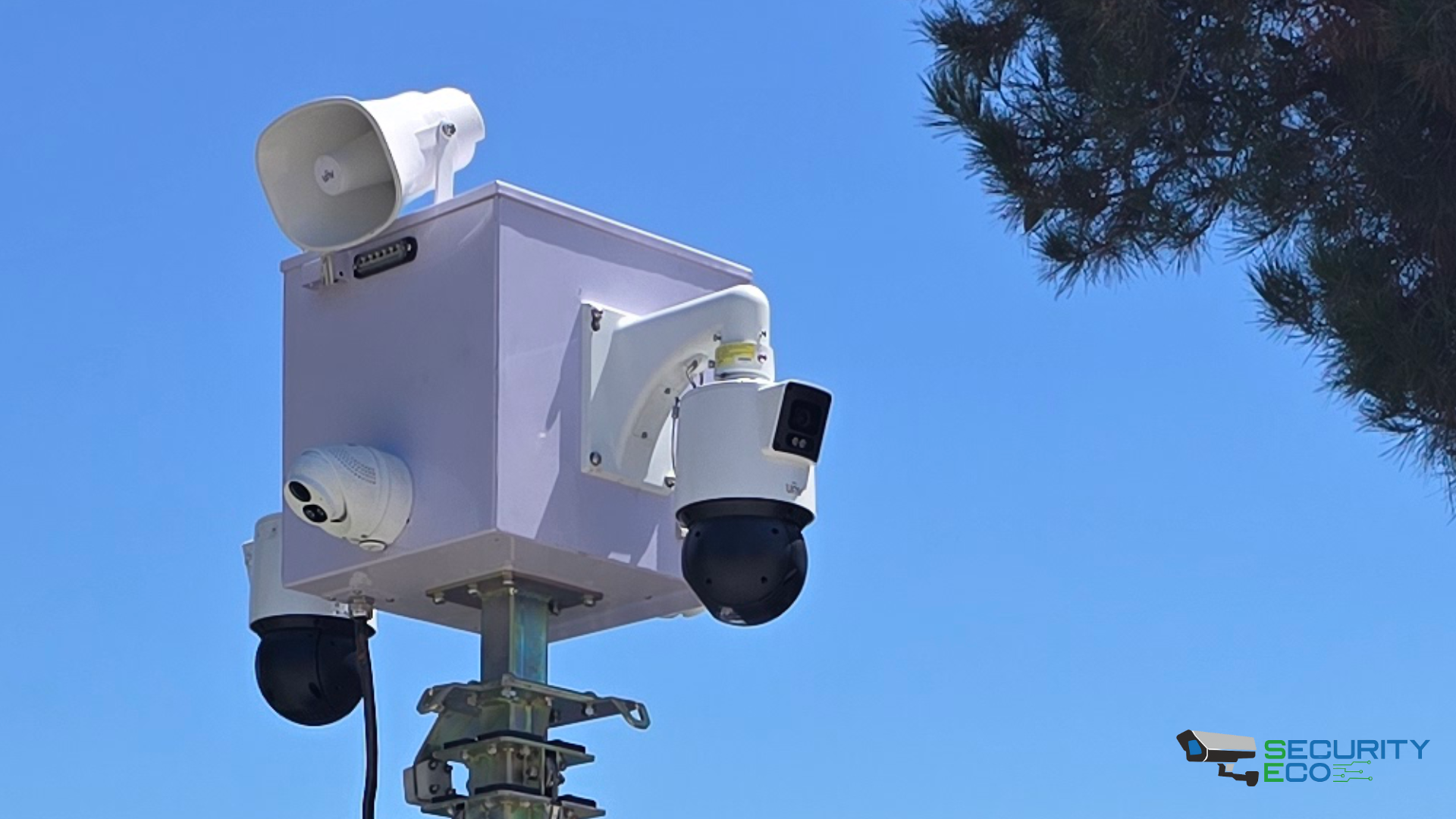 Close-up of camera head with multiple PTZ and spotlight units mounted on trailer mast